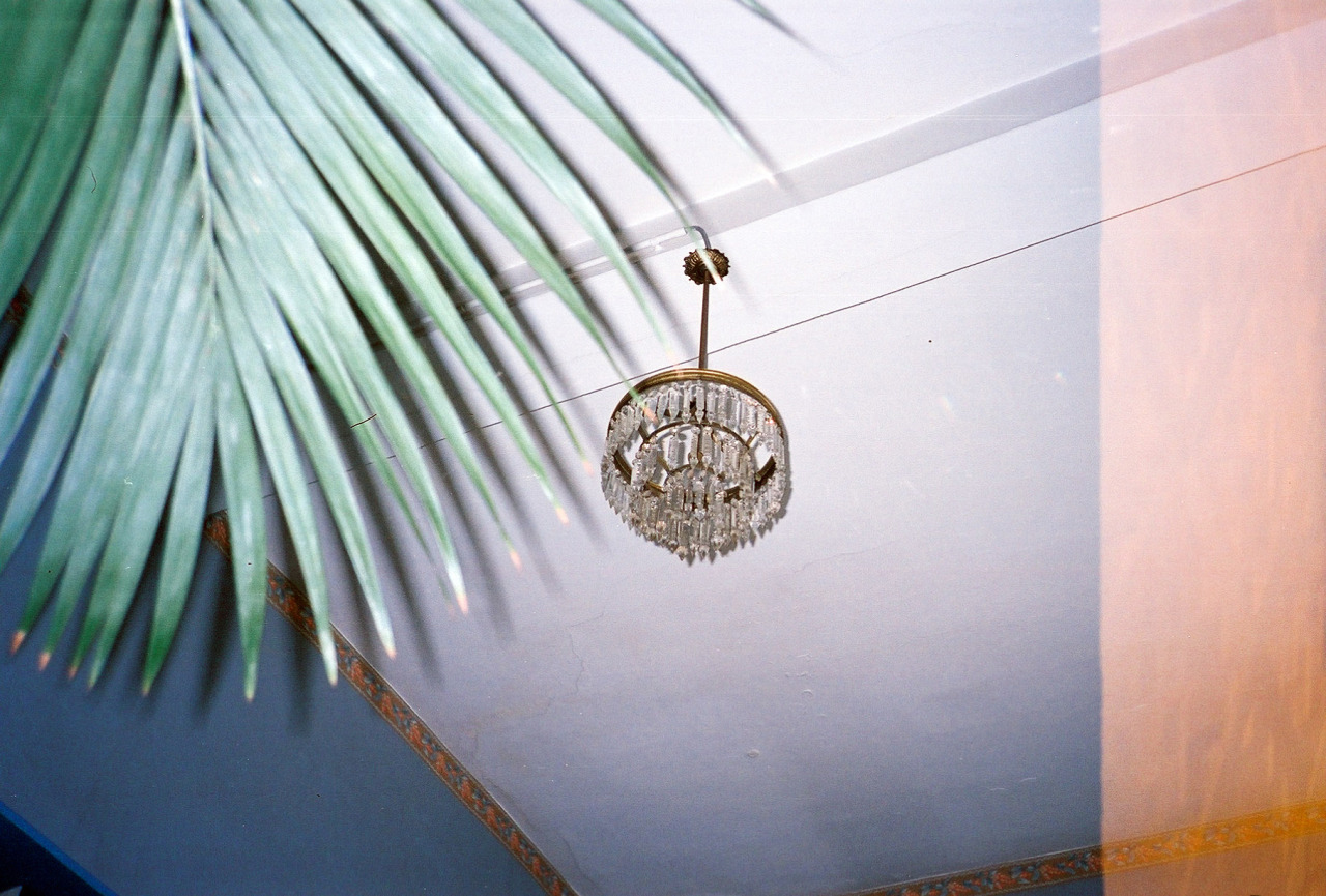 elaborate crystal light hangs from ceiling