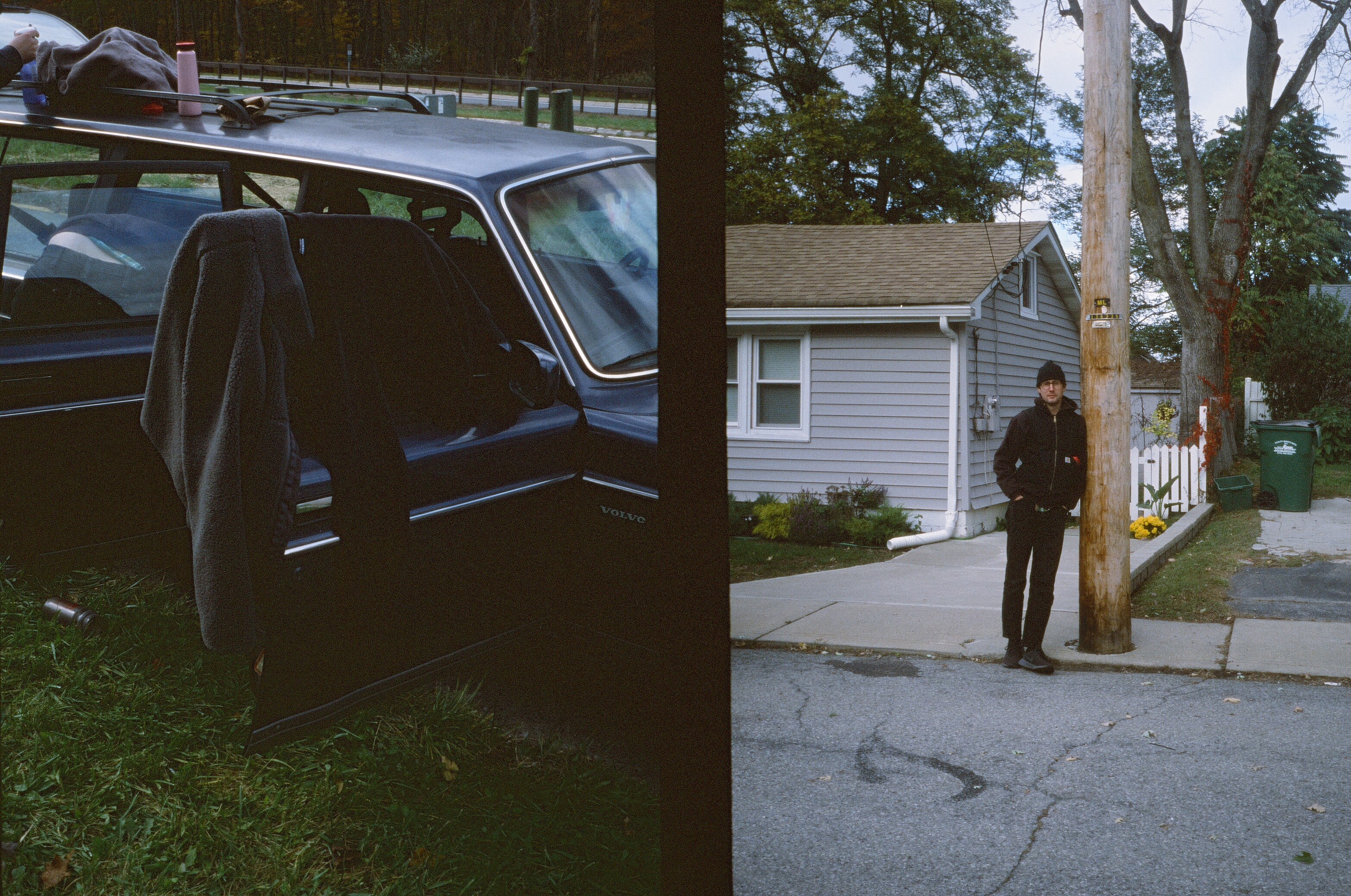 clothes hang dry on an open car door and someone leans against a telephone pole