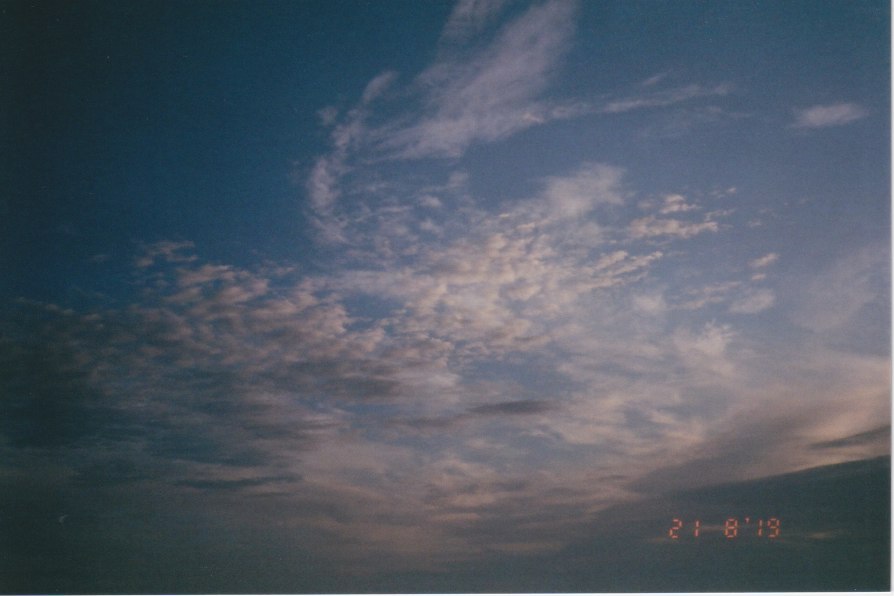 thin patchy sheet-like clouds in blue sky